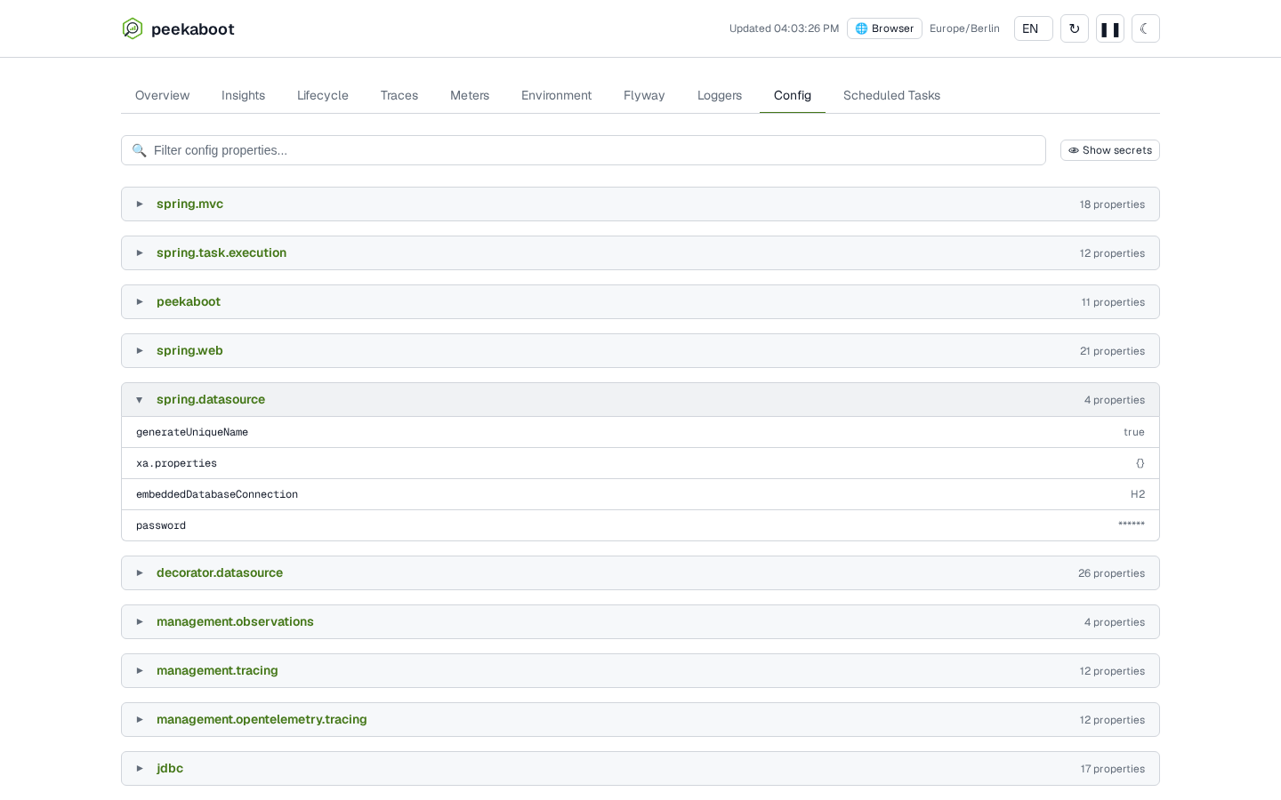 The Config tab with the spring.datasource group expanded, its password value rendered as ****** alongside real values for its other properties, with a Show secrets toggle above the group list.