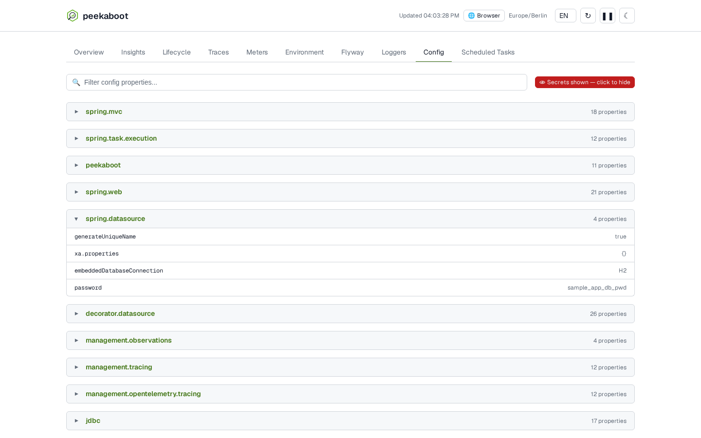 The same spring.datasource group after clicking Show secrets. Its password value now reads sample_app_db_pwd instead of ******, and everything else on the tab is unchanged.